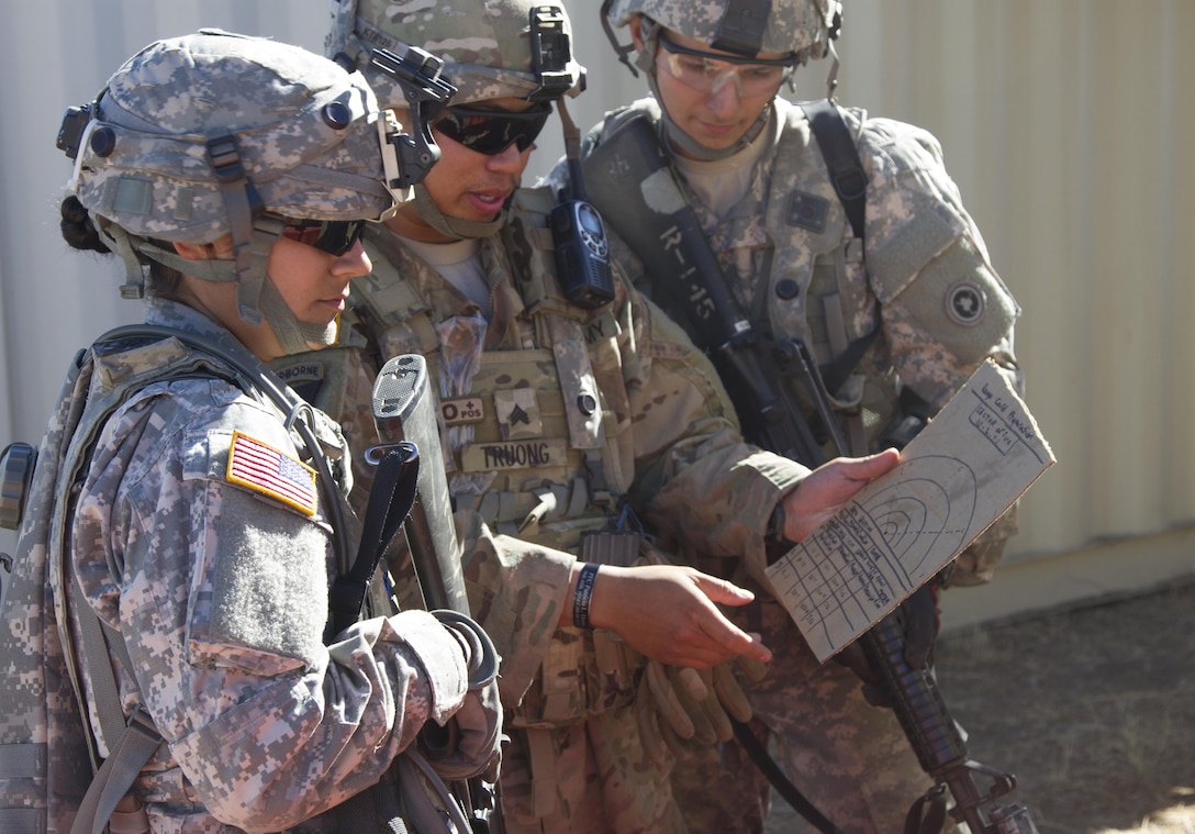 A U.S. Army Reserve Sgt. Kevin Troung, 1017th Quartermaster Company, Camp Pendleton,Calif., reviews a range card with Spc. April Smith and Sgt. Eric Terrill, in preparation for atactical scenario during Combat Support Training Exercise 91-16-02, Fort Hunter Liggett, Calif.,June 17, 2016. As the largest U.S. Army Reserve training exercise, CSTX 91-16-02 providesSoldiers with unique opportunities to sharpen their technical and tactical skills in combat-likeconditions. (U.S. Army photo by Sgt. Krista L. Rayford, 367th Mobile Public AffairsDetachment)