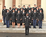 Army Brig. Gen. Richard Dix, DLA Distribution commander, stands with 19 newly-commissioned 2nd lieutenants from the Bison Battalion. 
