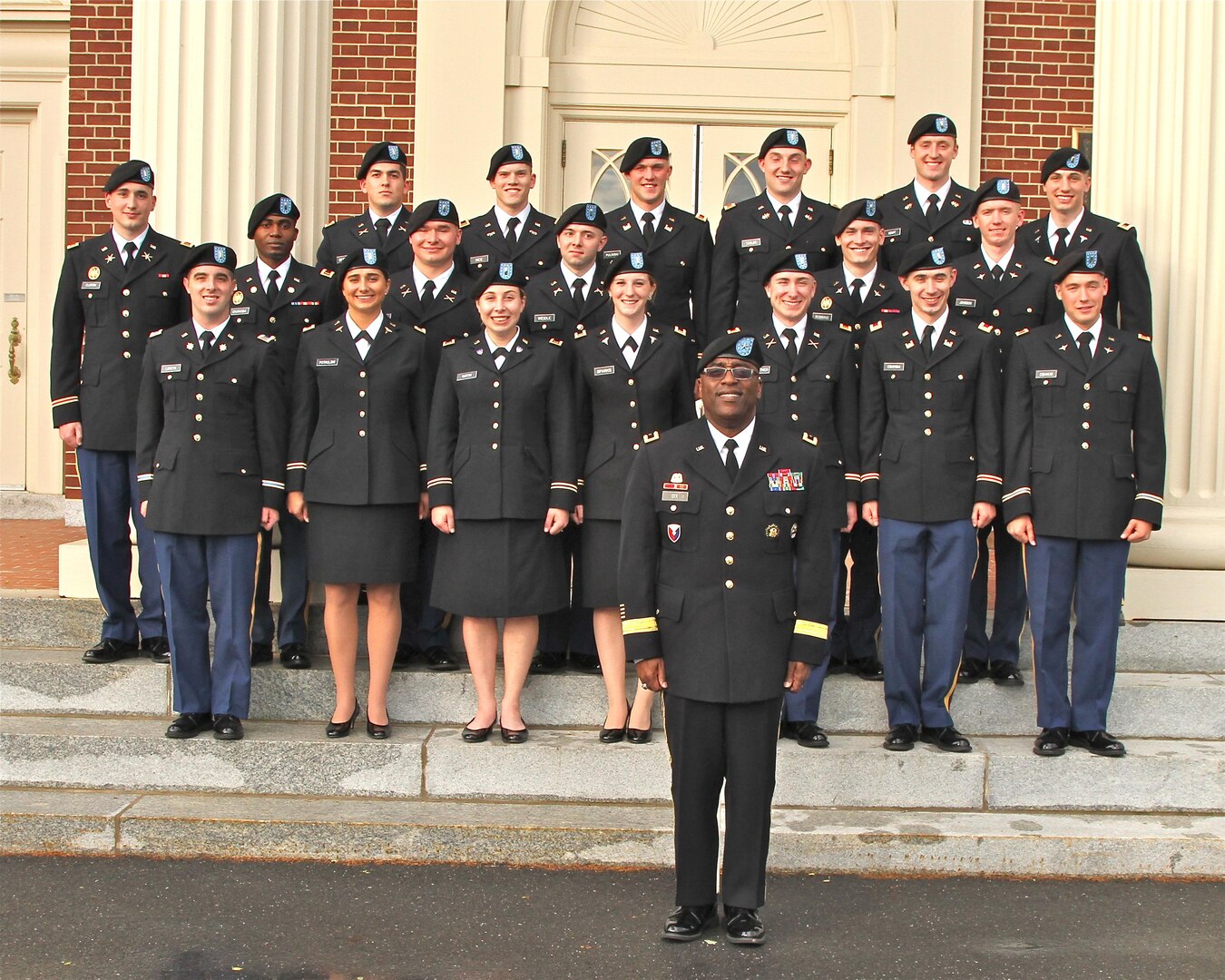 Army Brig. Gen. Richard Dix, DLA Distribution commander, stands with 19 newly-commissioned 2nd lieutenants from the Bison Battalion. 