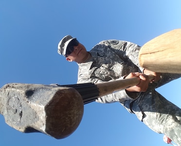 Fort A.P. Hill, Va. — Sgt Oscar Sevilla of Chicago puts in a tent stake. The Army Reserve Soldier with the 956th Movement Control Team was part of a recovery crew putting up tents after a severe storm struck Archer Camp at Fort A.P. Hill, Va., on June 17. The 956th MCT were taking part in Quartermaster Liquid Logistics Exercise 2016. (U.S. Army photo by Sgt. 1st Class Claude Dixon, 372nd Mobile Public Affairs Detachment)