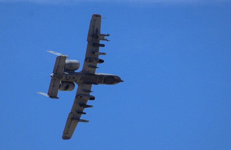 An A-10 Warthog, assigned to the 66th Weapons Squadron, Nellis Air Force Base, Nevada, preforms close air support during Joint Forcible Entry Exercise on the Nevada Test and Training Range, June 16, 2016. A-10s are simple, effective and survivable twin-engine jet aircraft that can be used against all ground targets, including tanks and other armored vehicles. (U.S. Air Force photo by Airman 1st Class Kevin Tanenbaum)