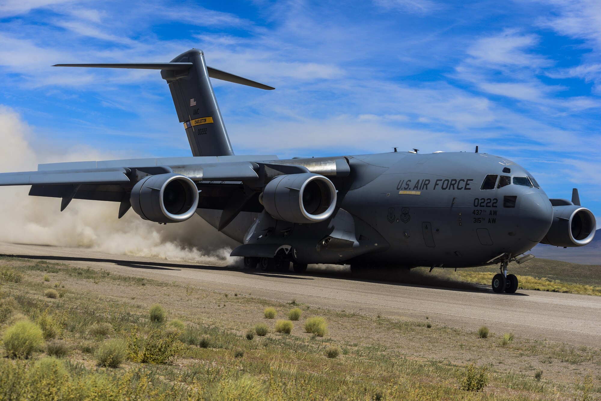 A C-17 Globemaster III, assigned to the 17th Weapons Squadron, Nellis Air Force Base, Nevada, lands on an airstrip in the Nevada Test and Training Range during Joint Forcible Entry Exercise, June 16, 2016. JFEX is meant to be a challenge for aircrews and ground combat units involved, it's just as much an evaluation of the mission leadership's ability to efficiently integrate ground forces and dissimilar aircraft into one "strike package."  (U.S. Air Force photo by Airman 1st Class Kevin Tanenbaum)