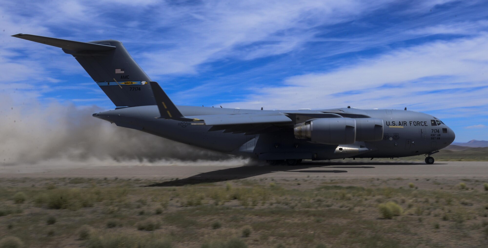 A C-17 Globemaster III, assigned to the 17th Weapons Squadron, Nellis Air Force Base, Nevada, lands on an airstrip in the Nevada Test and Training Range during Joint Forcible Entry Exercise, June 16, 2016. During the Joint Forcible Entry exercise, pilots’ flying skill and decision making was tested in the execution of various missions in a contested environment. (U.S. Air Force photo by Airman 1st Class Kevin Tanenbaum)