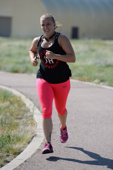 Krystal Conkling, 50th Space Wing, crosses the finish line during the 12th annual duathlon at Schriever Air Force Base, Colorado, Friday, June 17, 2016. Conkling finished first among females in the event with a time of 1:28:08. (U.S. Air Force photo/Christopher DeWitt)