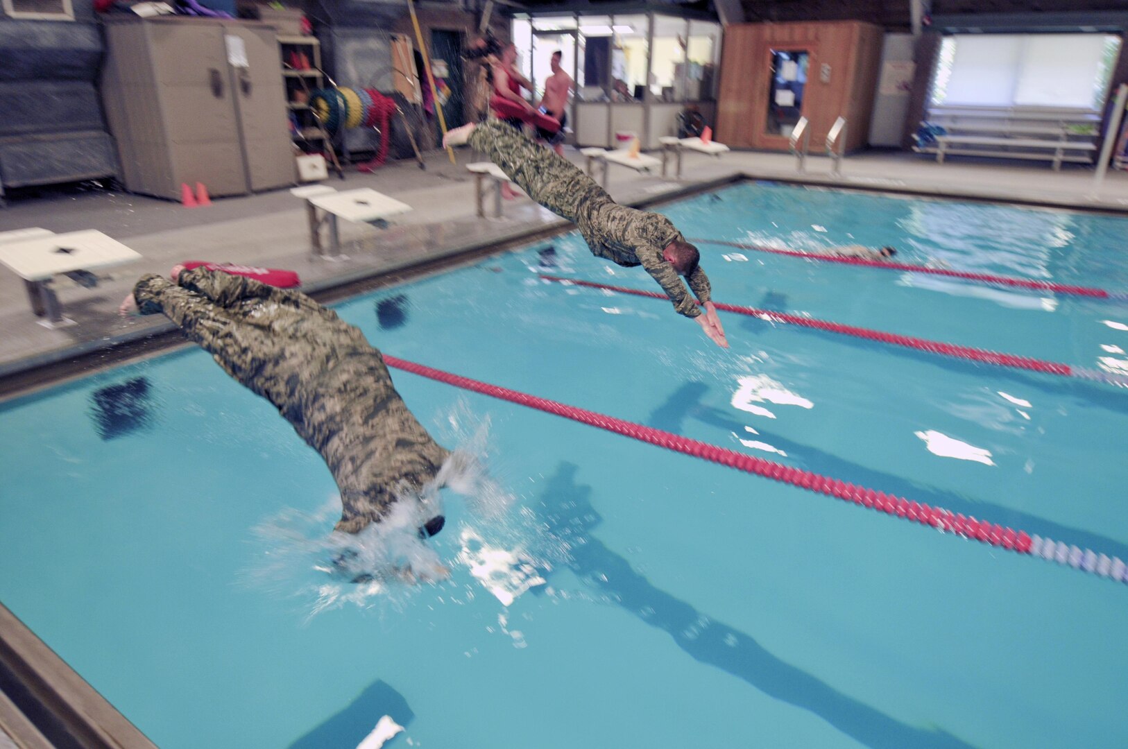 New York Air National Guard Senior Airman Dominic Scaringe and Staff Sgt. Jeffrey Valk compete in the swim portion of the German Armed Forces Proficiency Badge Competition on June 16, 2016, at the Glenville, N.Y., YMCA. Eight Airmen with the 109th Airlift Wing competed in the second phase of the competition - to qualify they needed to swim 100 meters in under 4 minutes. The unit is based at Stratton Air National Guard Base in Scotia, N.Y.