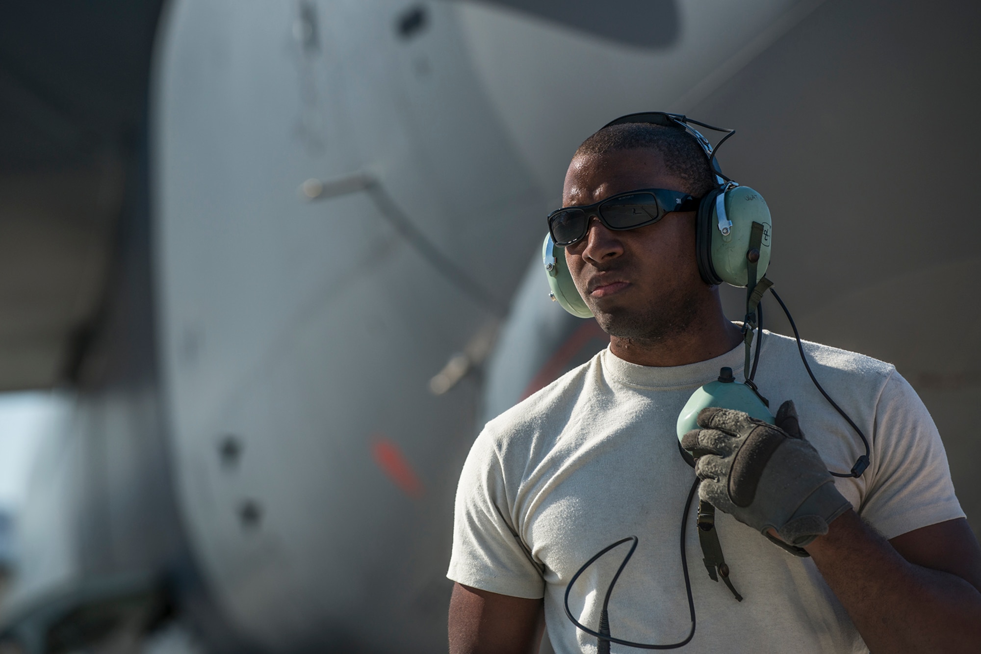U.S. Air Force Staff Sgt. Lael Isaac, a 307th Aircraft Maintenance Squadron crew chief, listens to the aircrew of a B-52H Stratofortress prior to a mission on June 8, 2016, Nellis Air Force Base, Nev. Isaac is among 45 Active Duty and Air Force Reserve maintenance personnel on temporary duty at Nellis in support of the 340th Weapons Squadron. (U.S. Air Force photo by Master Sgt. Greg Steele/Released)