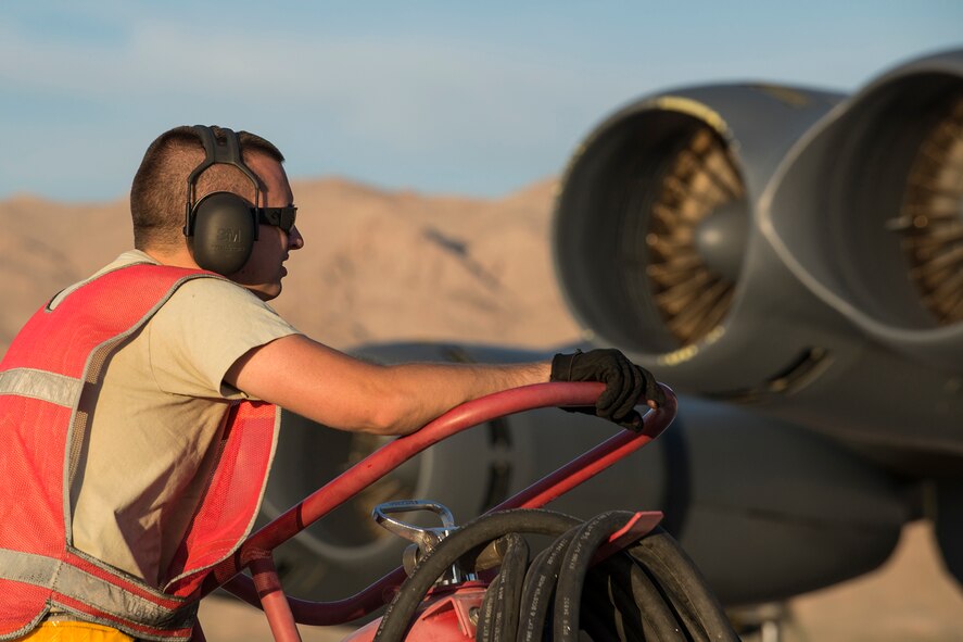 U.S. Air Force Staff Sgt. Michael Megivern, a 11th Aircraft Maintenance Unit crew chief, mans a fire extinguisher during engine start of a B-52H Stratofortress prior to a mission on June 8, 2016, Nellis Air Force Base, Nev. Megivern is among 45 Active Duty and Air Force Reserve maintenance personnel on temporary duty at Nellis in support of the 340th Weapons Squadron. (U.S. Air Force photo by Master Sgt. Greg Steele/Released)