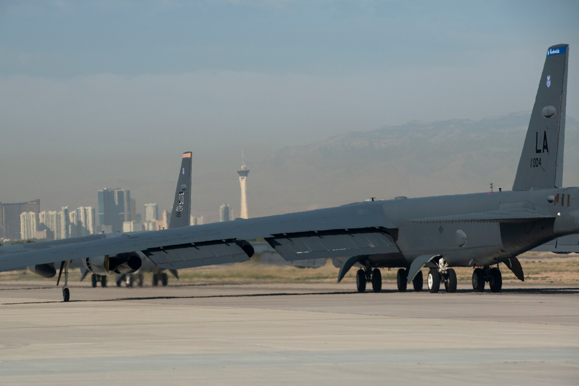 Two U.S. Air Force B-52H Stratofortress bombers taxi for a mission in support of the 340th Weapons Squadron (WPS) on June 8, 2016, Nellis Air Force Base, Nev. The lead B-52 is assigned to the Air Force Reserve Command’s 307th Bomb Wing and the other is assigned to the 2nd Bomb Wing, both from Barksdale Air Force Base, La. (U.S. Air Force photo by Master Sgt. Greg Steele/Released)