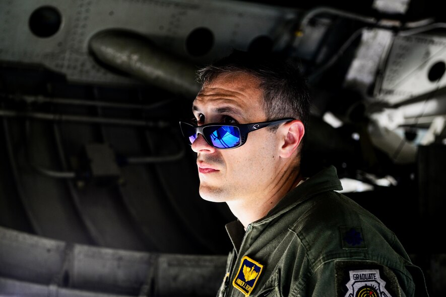 Lt. Col. Andrew Bemis, Air Combat Command B-52 Stratofortress pilot, performs a preflight inspection before a B-52 and B-1 Lancer integration flight at Barksdale Air Force Base, La., June 15, 2016. During the flight, crews coordinated and completed several simulated bomb drops. (U.S. Air Force photo/Senior Airman Luke Hill)