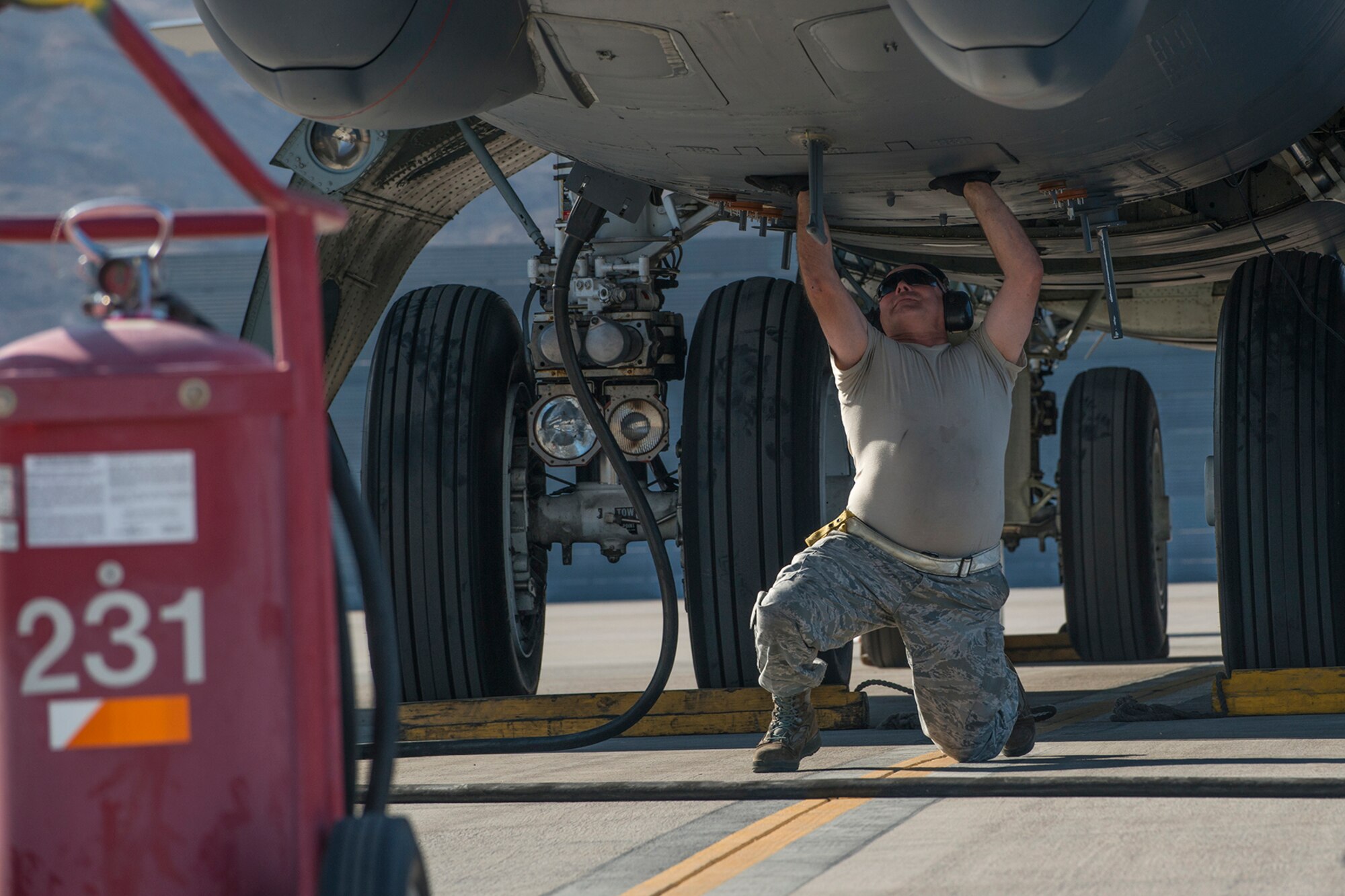 U.S. Air Force Tech. Sgt. James Spencer, a 307th Aircraft Maintenance Squadron crew chief, shuts the hatch on a B-52H Stratofortress before it takes off on for a mission on June 8, 2016, Nellis Air Force Base, Nev. Spencer is among 45 Active Duty and Air Force Reserve maintenance personnel on temporary duty at Nellis in support of the 340th Weapons Squadron. (U.S. Air Force photo by Master Sgt. Greg Steele/Released)