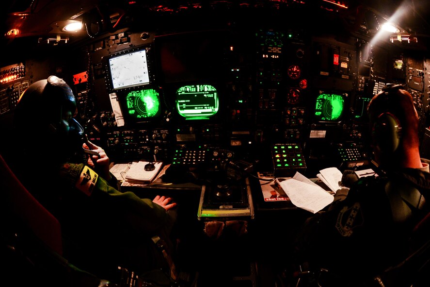 Maj. John Mullins, 11th Bomb Squadron combat systems officer, left, and Capt. Dane Kidman, 28th Bomb Squadron navigator, work together during a B-52 Statofortress and B-1 Lancer integration flight June 15, 2016. Kidman who is traditionally a B-1 navigator from Dyess Air Force Base, Texas, teamed up with the B-52 crew during the integration flight. (U.S. Air Force photo/Senior Airman Luke Hill)