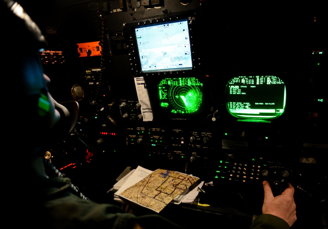 Maj. John Mullins, 11th Bomb Squadron combat systems officer, aims at a target during a B-52 Startofortress and B-1 Lancer integration flight June 15, 2016. Combat systems officers employ a wide range of high-tech equipment and weaponry to deliver unmatched power and mobility to successfully accomplish their missions. (U.S. Air Force photo/Senior Airman Luke Hill)