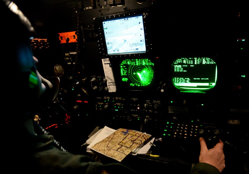 Maj. John Mullins, 11th Bomb Squadron combat systems officer, aims at a target during a B-52 Startofortress and B-1 Lancer integration flight June 15, 2016. Combat systems officers employ a wide range of high-tech equipment and weaponry to deliver unmatched power and mobility to successfully accomplish their missions. (U.S. Air Force photo/Senior Airman Luke Hill)