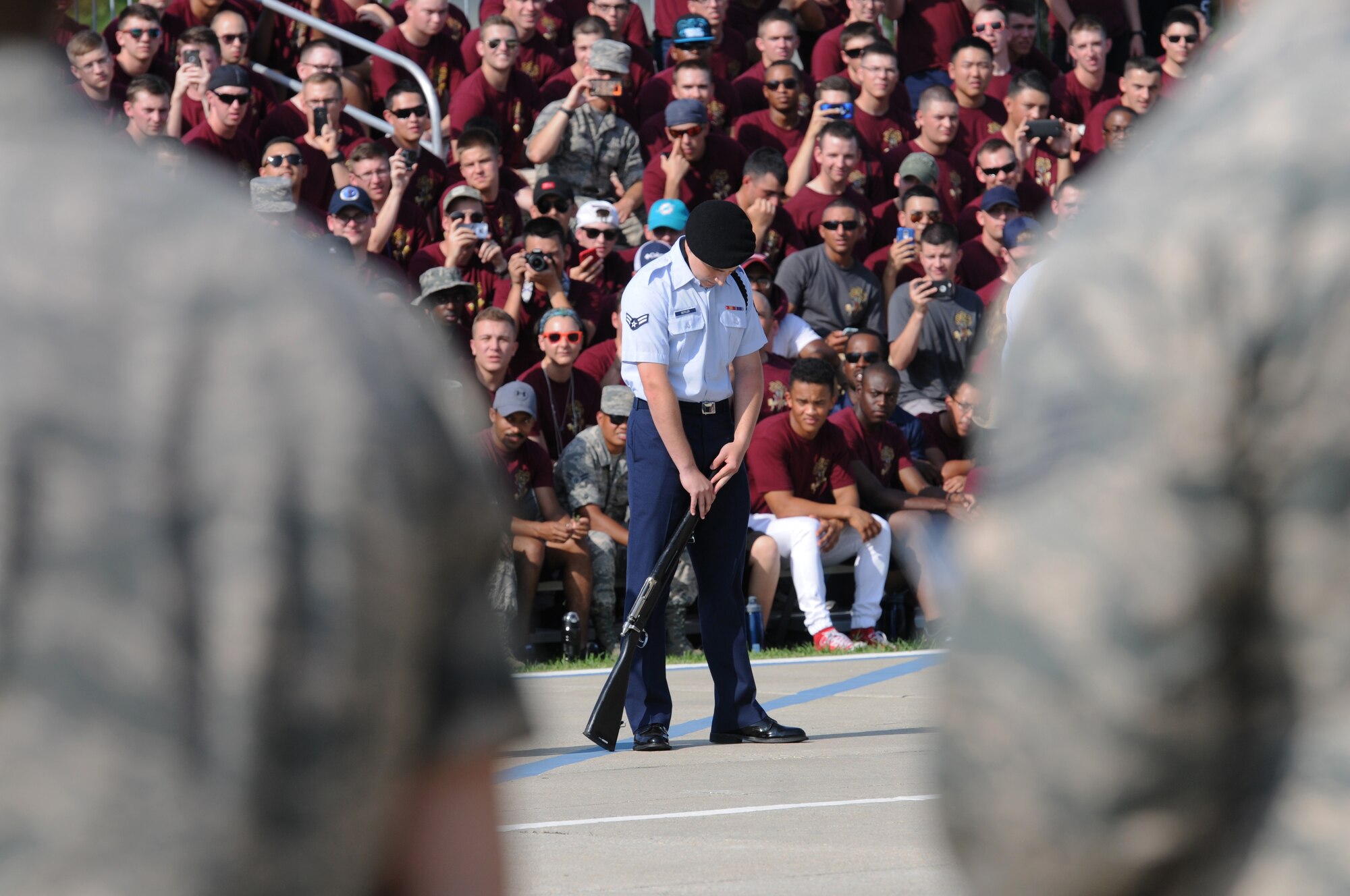 Airman 1st Class Dillen Butler, 338th Training Squadron freestyle drill team member, performs during the 81st Training Group drill down at the Levitow Training Support Facility drill pad June 17, 2016, Keesler Air Force Base, Miss. The 338th TRS “Dark Knights” competed in the open ranks, regulation and freestyle competitions. (U.S. Air Force photo by Kemberly Groue)