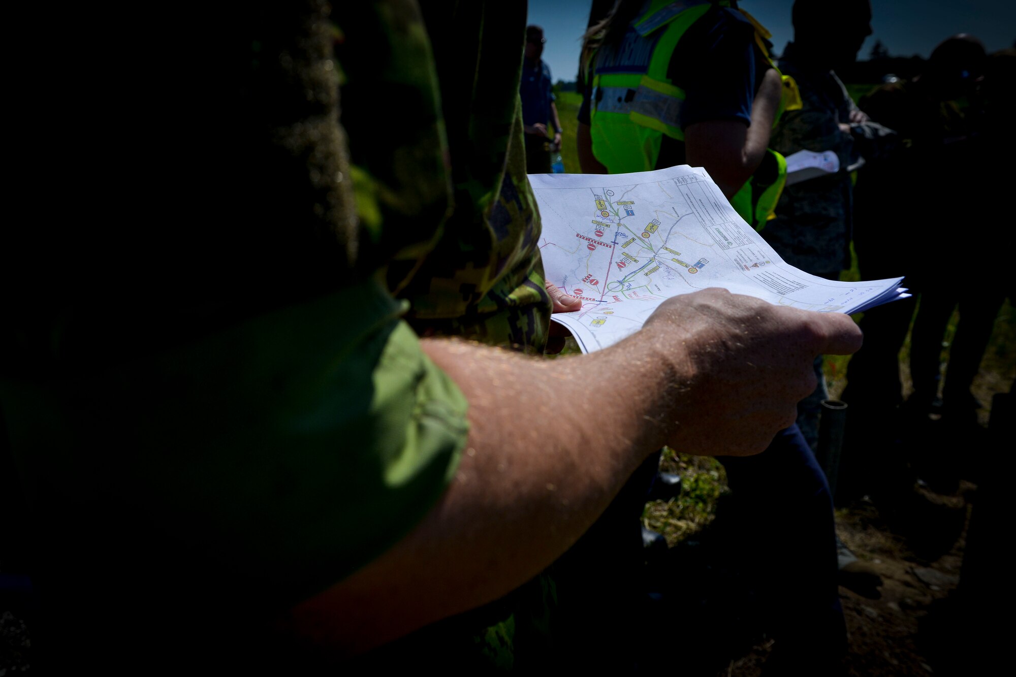 An Estonian airman holds a map of the area before NATO forces prepare a highway for aircraft to land on June 21, 2016, in Tallinn, Estonia. U.S. forces are in Europe participating in Saber Strike 16; a long-standing, U.S. Joint Chiefs of Staff-directed, U.S. Army Europe-led cooperative-training exercise, which has been conducted annually since 2010.  This year’s exercise will focus on promoting interoperability with allies and regional partners. The United States has enduring interests in supporting peace and prosperity in Europe and bolstering the strength and vitality of NATO, which is critical to global security. (U.S. Air Force photo/Senior Airman Nicole Keim)