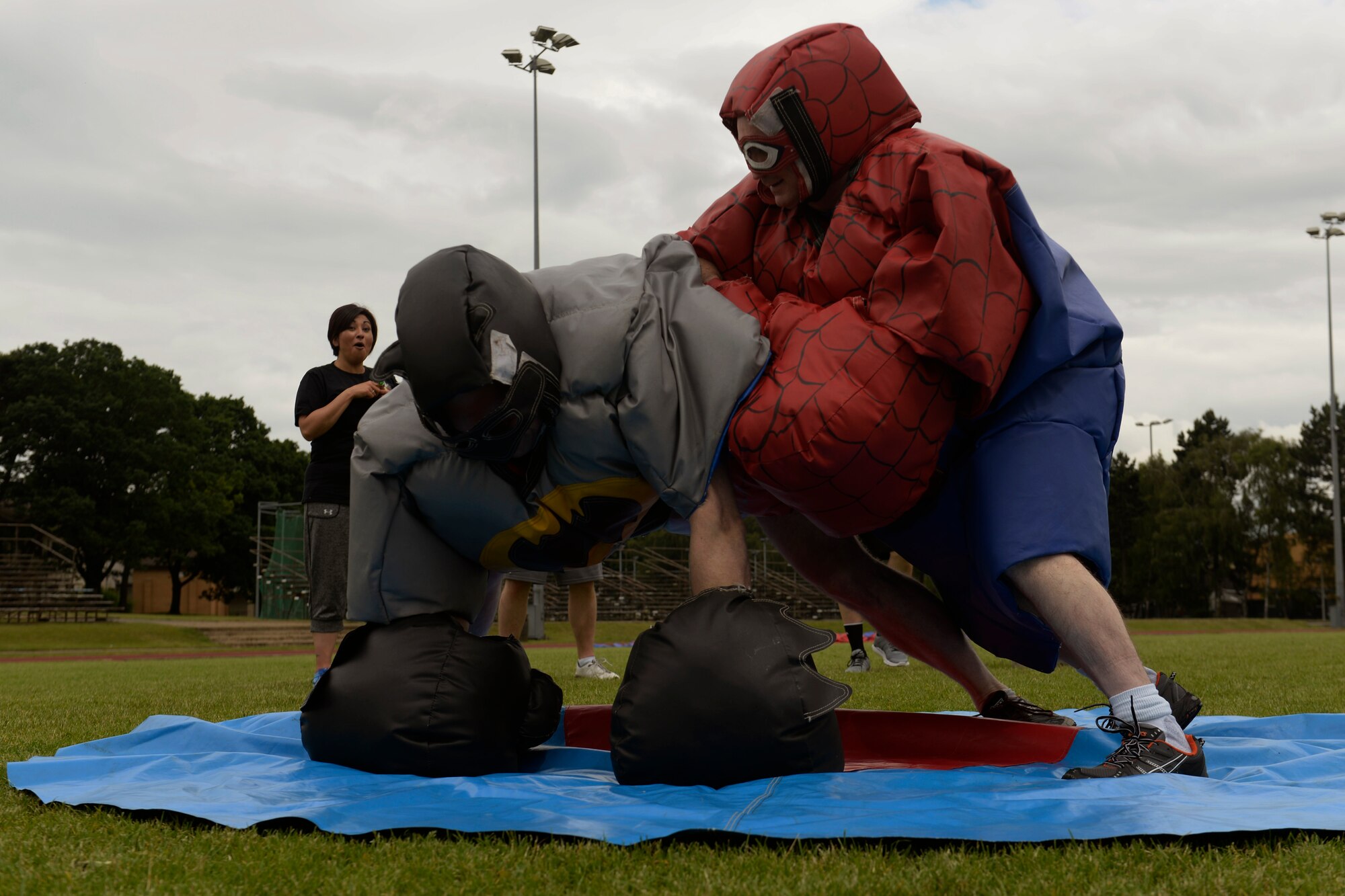 Master Sgt. Corey Quinn, 48th Communications Squadron first sergeant, right, wrestles with Maj. Sean Brazel, 48th Force Support Squadron commander, during the second annual 48th Mission Support Group Olympics at Royal Air Force Lakenheath, England, June 16, 2016. The sumo wrestling competition is one of nine events pitting Airmen against each other as part of a friendly rivalry. (U.S. Air Force photo/ Airman 1st Class Abby L. Finkel)