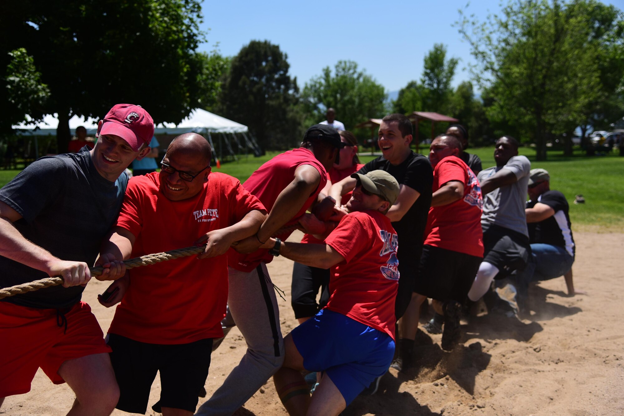 PETERSON AIR FORCE BASE, Colo. – The Force Support Squadron throws their weight together to dominate at tug-o-war during the annual Sports and Field Day at Peterson Air Force Base, Colo., June 16, 2016. The 27 different events were scattered throughout the base and lasted until 2 p.m. (U.S. Air Force photo by Staff Sgt. Amber Grimm)
