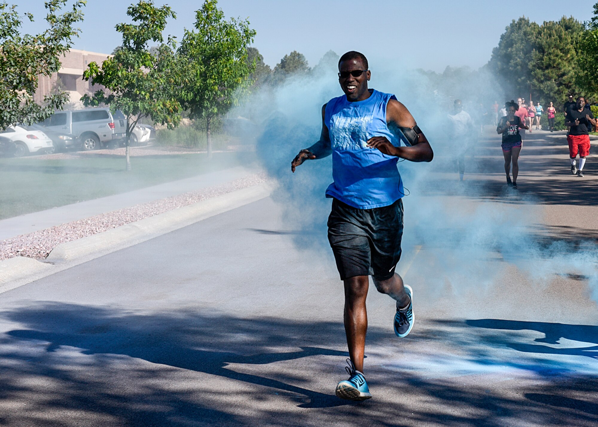 PETERSON AIR FORCE BASE, Colo. – Senior Airman Kelvin Smith, 21st Comptroller Squadron, gets blasted during a color run at the annual Sports and Field Day at Peterson Air Force Base, Colo., June 16, 2016. Team Pete members had the option to participate in 27 events ranging from archery and the color run to bowling and wallyball. (U.S. Air Force photo by Senior Airman Rose Gudex)
