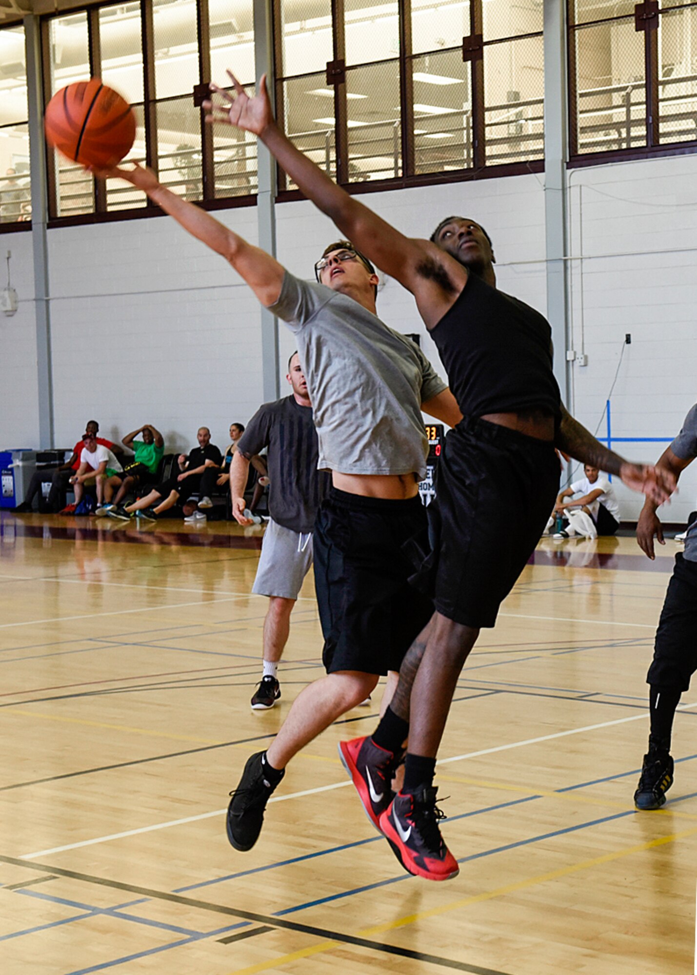 PETERSON AIR FORCE BASE, Colo. – Peterson Airmen compete in basketball at the base fitness center during the annual Sports and Field Day at Peterson Air Force Base, Colo., June 16, 2016. Airmen could compete in any of 27 events, enjoy live music and refreshments, and cheer on their peers during the awards ceremony. (U.S. Air Force photo by Senior Airman Rose Gudex)