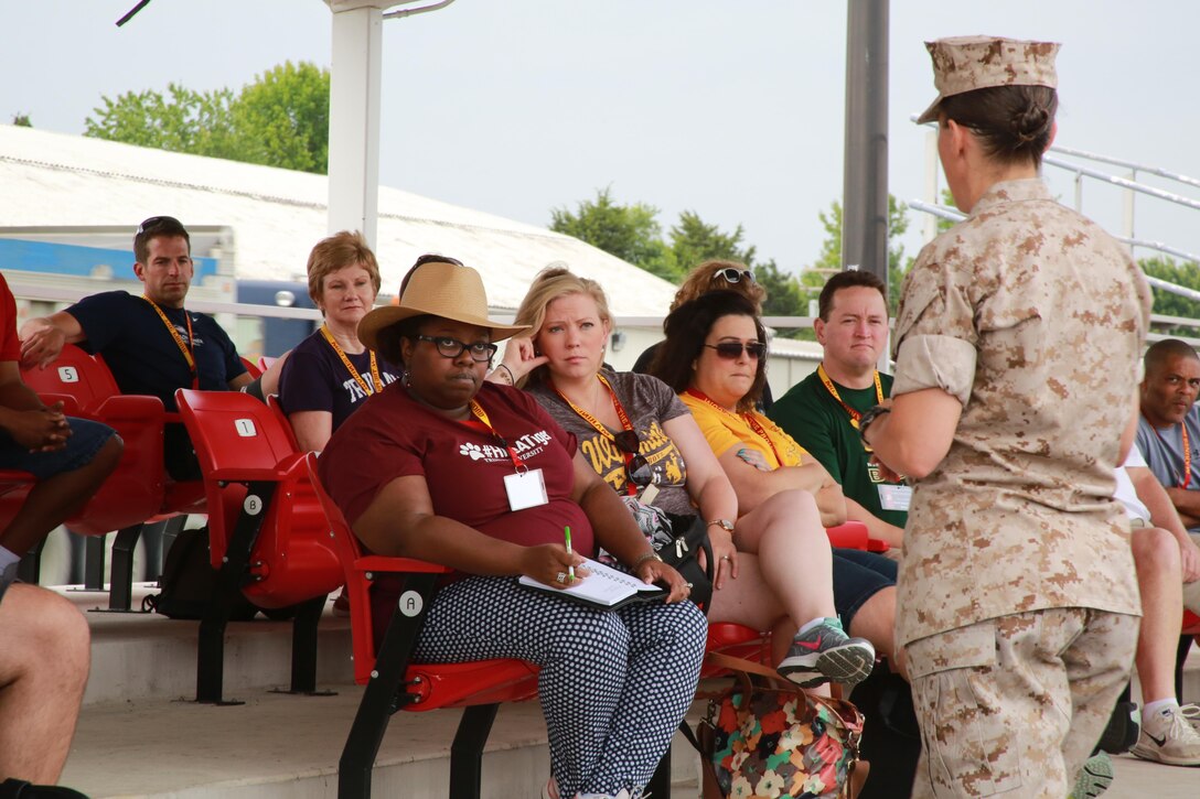 Colonel Julie L. Nethercot speaks with and answers questions from approximately 40 educators from states west of the Mississippi River at the Officer Candidates School Parade Deck aboard Marine Corps Base Quantico, Va., June 21 for the 2016 Key Leaders and Educators Workshop. The workshop includes events such as infantry patrolling, flight simulations and many others. The week-long workshop creates mutually beneficial relationships between educators and the Marine Corps where key leaders can better guide college students interested in becoming Marine officers based on firsthand experience. Nethercot is the commanding officer of OCS.