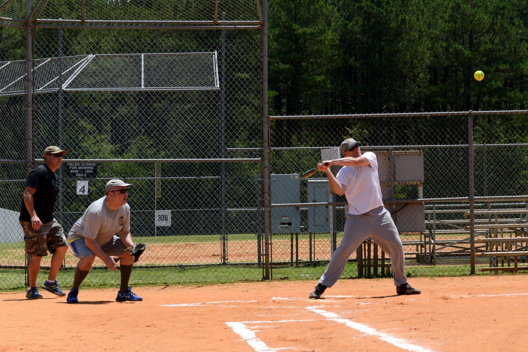 U.S. Air Force Col. Stephen Jost, 20th Fighter Wing commander, prepares to swing a bat at a softball during a chiefs vs. colonels softball game at Shaw Air Force Base, S.C., June 17, 2016. Colonels challenged chiefs during a softball game supporting one of Jost’s four top priorities. Jost introduced his top priorities as the four C’s: combat-readiness, compliance, community and core values.  (U.S. Air Force photo by Airman 1st Class Destinee Dougherty)