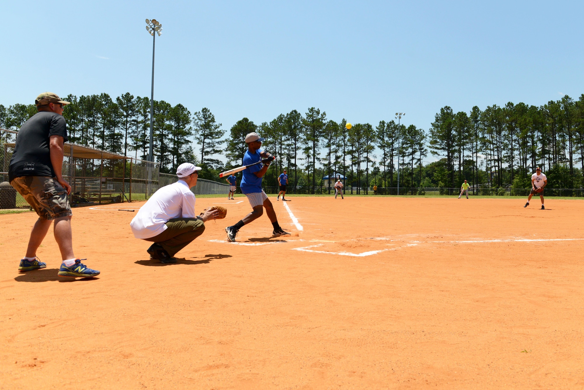U.S. Air Force chief master sergeants and colonels play ball against each other during a chiefs vs. colonels softball game at Shaw Air Force Base, S.C., June 16, 2016. The game ended with the chief’s victory and a score of 11-8. (U.S. Air Force photo by Airman 1st Class Destinee Dougherty)