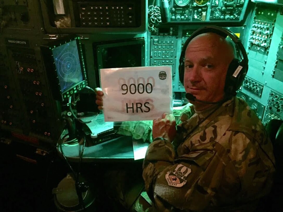 Lt. Col. Barry Cupples, Jr., 328th Airlift Squadron navigator, poses as he surpasses 9,000 flying hours, June 3, 2016. Cupples attained this milestone while deployed in support of Operation Inherent Resolve. 