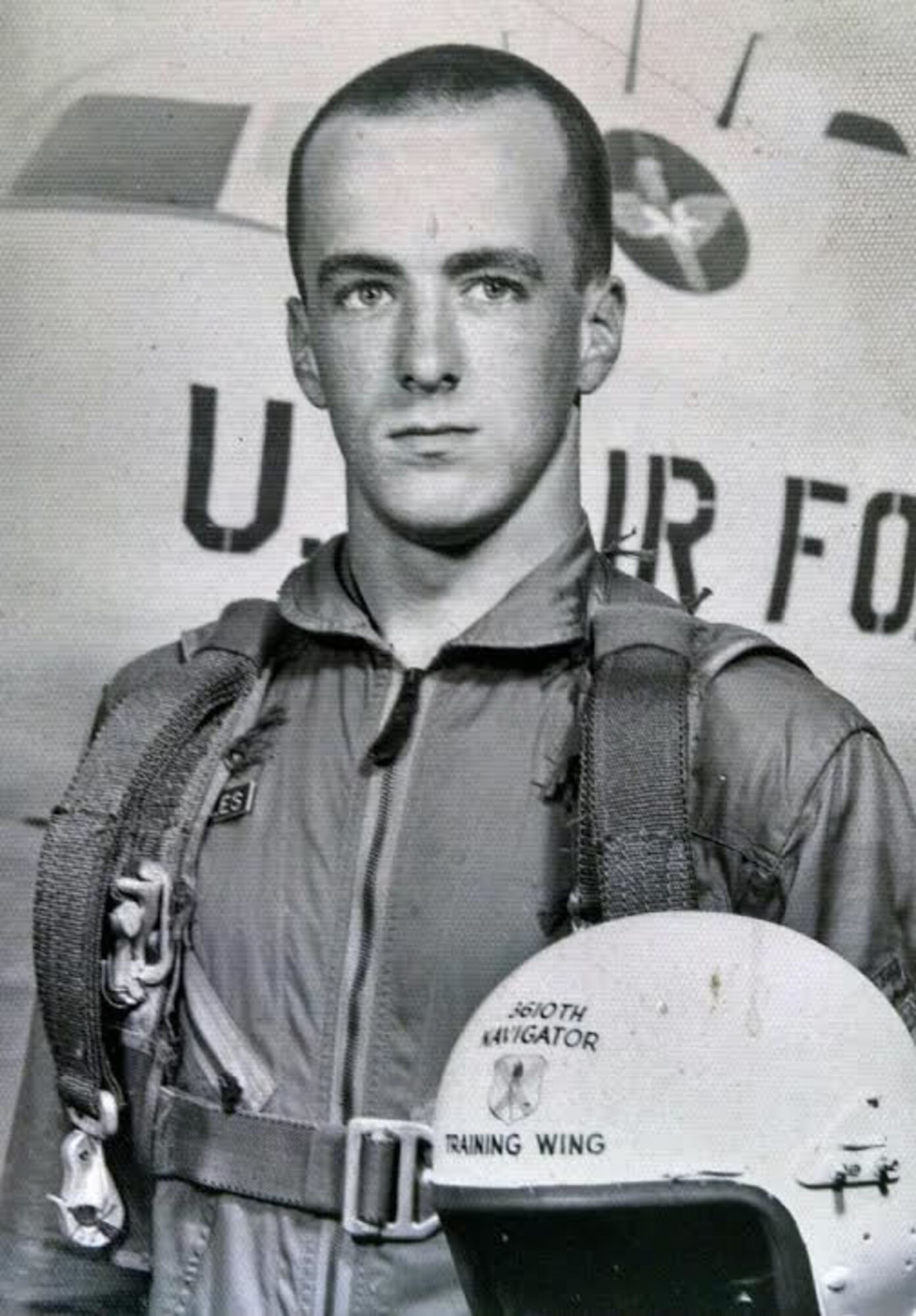 Lt. Col. Barry Cupples poses with an aircraft and helmet. Cupples is the father of current 328th Airlift Squadron Navigator, Lt. Col. Barry Cupples, Jr. The father and son flew together on the C-130 Hercules aircraft at Niagara Falls Air Reserve Station. 