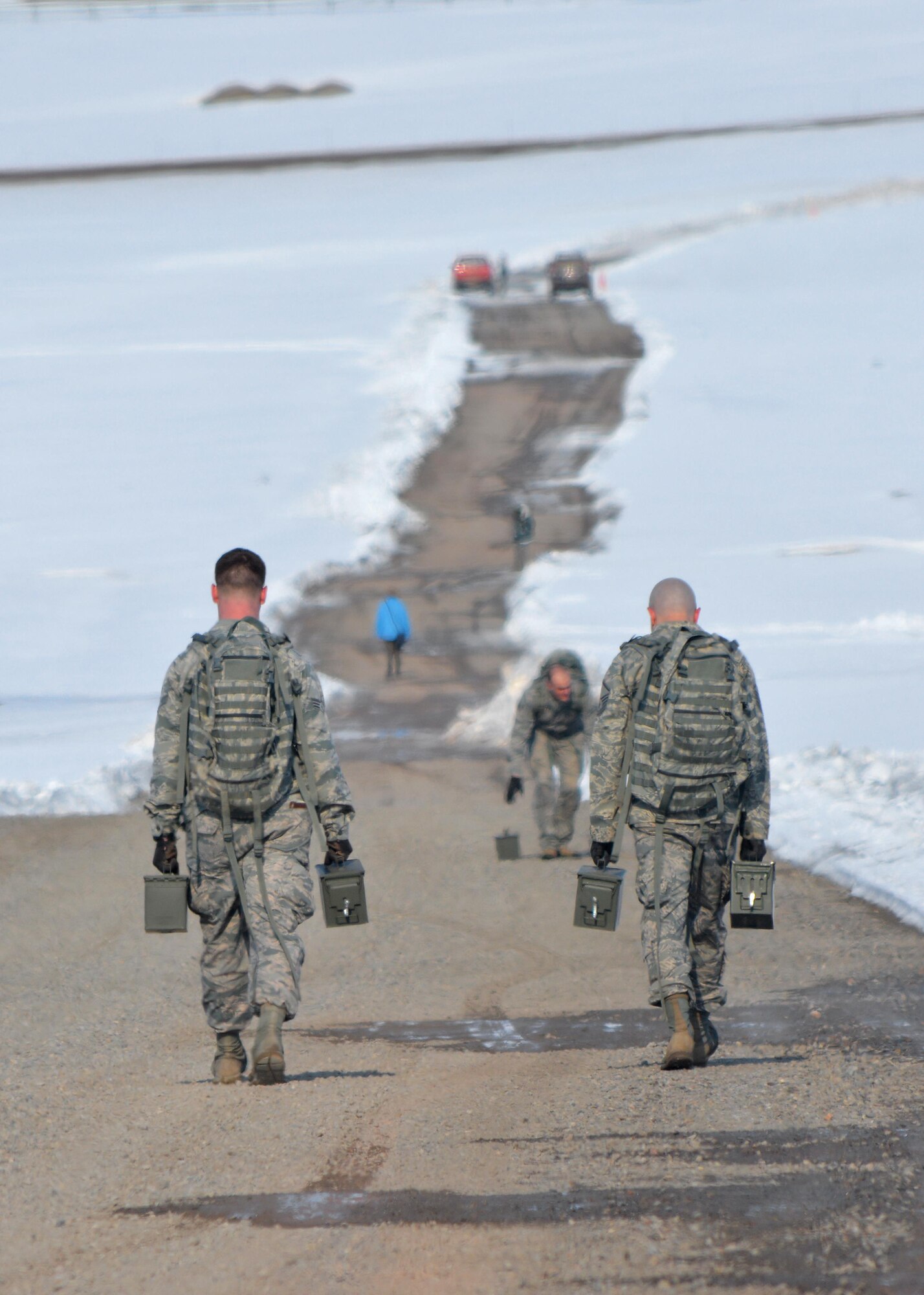 THULE AIR BASE, Greenland – 821st Security Forces Squadron defenders carry ammo cans as part of a ruck sack march for the Defender’s Challenge at Thule Air Base, Greenland, May 18, 2016. 821st SFS defenders participated in the challenge as part of Police Week. (U.S. Air Force photo by Tech. Sgt. Gary Chickery)