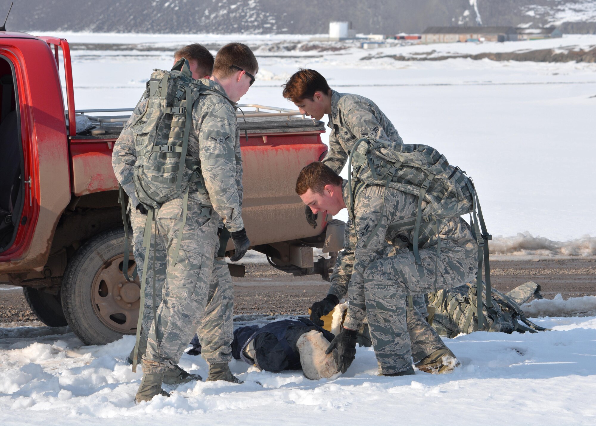 THULE AIR BASE, Greenland – 821st Security Forces Squadron defenders compete in the Self Aid and Buddy Care event of the Defender’s Challenge on May 18, 2016 at Thule Air Base, Greenland. The challenge was a way for 821st SFS to celebrate Police Week at the Top of the World. (U.S. Air Force photo by Tech. Sgt. Gary Chickery)