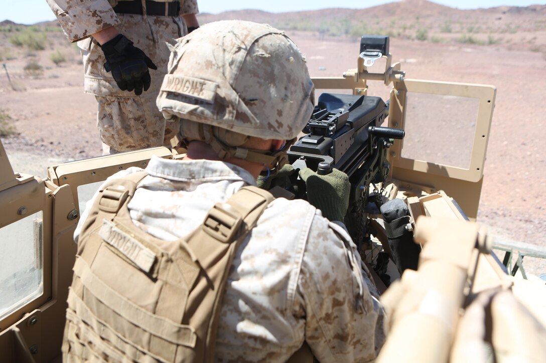Cpl. Dakota Wright, a motor transport operator with Motor Transport Company, Marine Wing Support Squadron (MWSS) 371, fires an MK-19 grenade launcher mounted on a Humvee at Yuma Proving Grounds, Ariz., June 16. Marines with MWSS-371 conducted crew-served weapons training with MK-19 grenade launchers and M2 .50-caliber machine guns mounted onto 7-ton trucks and Humvees to hone their skills and increase their readiness. (U.S. Marine Corps photo by Sgt. Brytani Wheeler/Released)