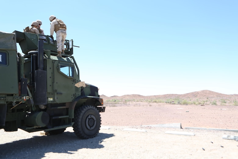 Marines with Motor Transport Company, Marine Wing Support Squadron (MWSS) 371, fire an M2 .50-caliber machine gun mounted on a 7-ton truck at Yuma Proving Grounds, Ariz., June 16. Marines with MWSS-371, conducted crew-served weapons training with MK-19 grenade launchers and M2 .50-caliber machine guns mounted onto 7-ton trucks and Humvees to hone their skills and increase their readiness. (U.S. Marine Corps photo by Sgt. Brytani Wheeler/Released)
