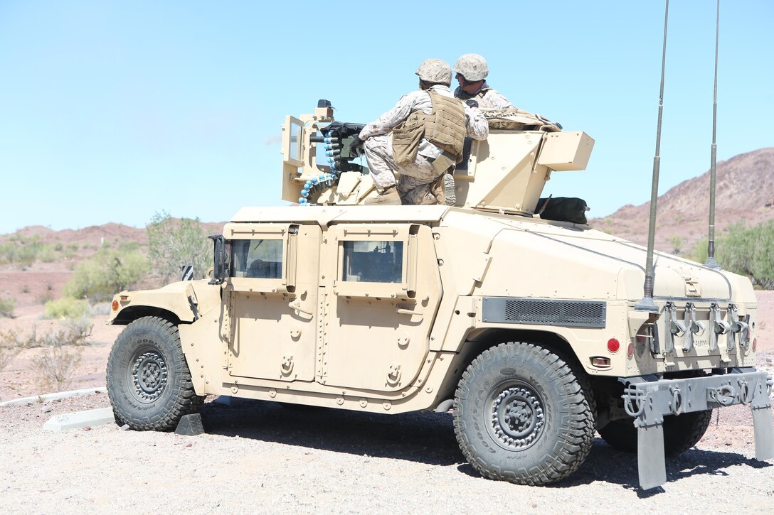 Marines with Motor Transport Company, Marine Wing Support Squadron (MWSS) 371, fire an MK-19 grenade launcher mounted on a Humvee at Yuma Proving Grounds, Ariz., June 16. Marines with MWSS-371 conducted crew-served weapons training with MK-19 grenade launchers and M2 .50-caliber machine guns mounted onto 7-ton trucks and Humvees to hone their skills and increase their readiness. (U.S. Marine Corps photo by Sgt. Brytani Wheeler/Released)
