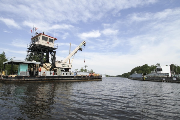 The Norfolk District, U.S. Army Corps of Engineers derrick boat ELIZABETH sits moored at the North Landing Bridge as contractors work to repair the bridge June 21, 2016. The ELIZABETH provided logistical support and manpower to the repair operations, which were needed after gearing was damaged by a barge strike on June 4. (U.S. Army photo/Patrick Bloodgood)