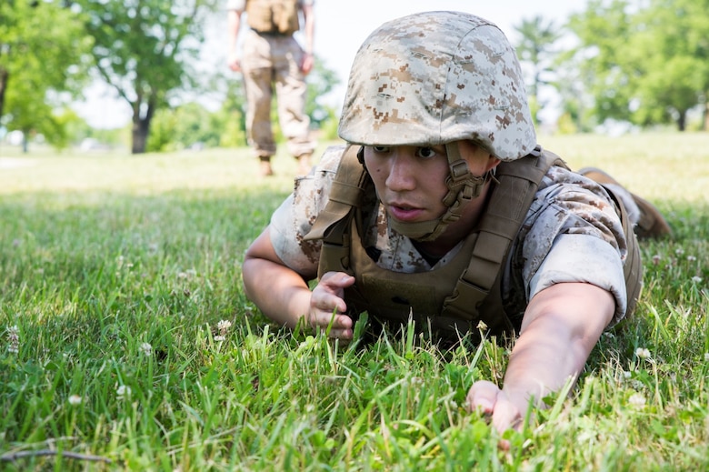 Sgt. Kenny Wen, a satellite communications operator with 6th Communications Battalion, Force Headquarters Group, Marine Forces Reserve, prepares to give commands to the platoon during hand and arm signal training at the Muscatatuck Urban Training Center in Butlerville, Ind., June 10, 2016. The Marines were also refreshed on buddy rushes and patrol formations during the training. (U.S. Marine Corps photo by Lance Cpl. Melissa Martens/ Released)