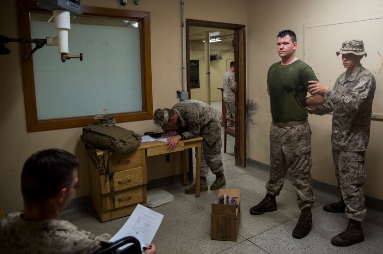 Marines with 4th Law Enforcement Battalion, Force Headquarters Group, Marine Forces Reserve, practiced processing inmates into the prison at the Muscatatuck Urban Training Center in Butlerville, Ind., June 14, 2016. The Marines conducted drills on different scenarios and learned how to run and sustain a prison safely and effectively. (U.S. Marine Corps photo by Lance Cpl. Melissa Martens/ Released)