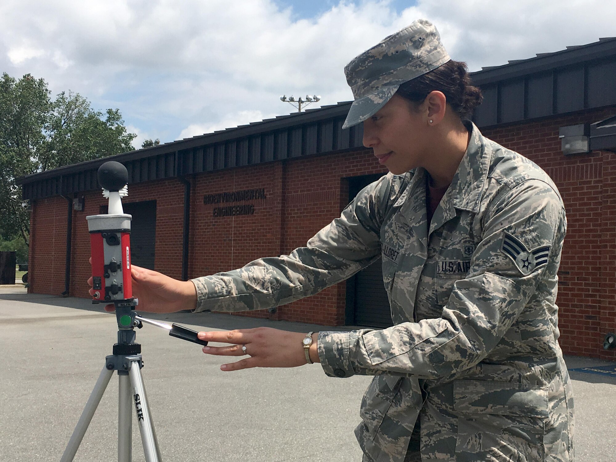 Senior Airman Amanda Vasquez-Lloret, a 4th Aerospace Medicine Squadron bioenvironmental engineering specialist, checks readings on a Web Bulb Globe Temperature heat stress monitor, June 17, 2016, at Seymour Johnson Air Force Base, North Carolina. The 4th AMDS bioenvironmental engineering flight monitors humidity, air temperature and radiant heat effects to determine heat stress risk flag categories and work/rest cycles. (Courtesy Photo)
