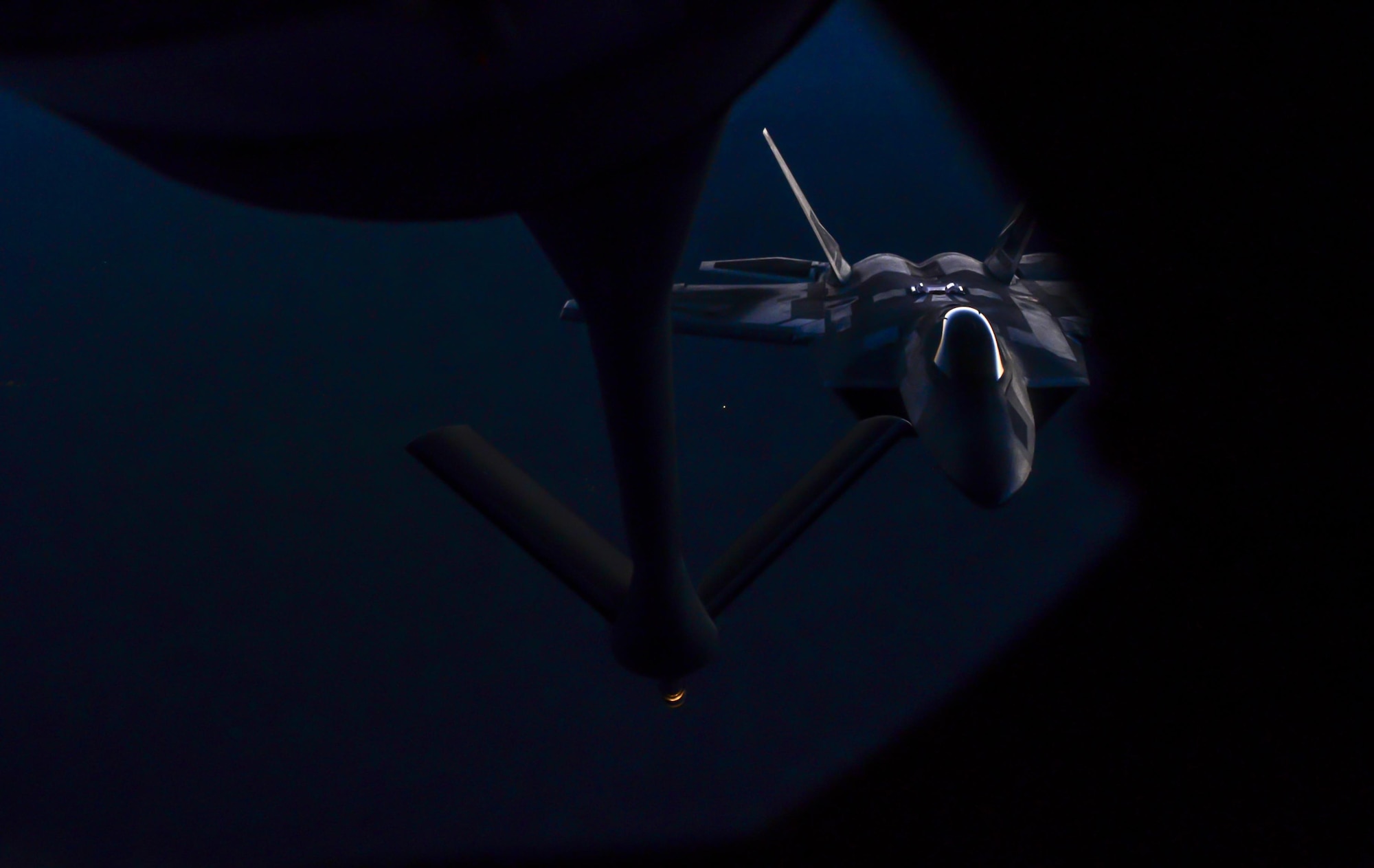 An F-22 Raptor, assigned to the 433rd Weapons Squadron, Nellis Air Force Base, Nev., prepares to be refueled during Deliberate Strike Night over the Nevada Test and Training Range, June 16, 2016. This focus makes DSN a distinctive part of Advanced Integration and the unique training of the select Airmen who earn the coveted Weapons School patch and who ensure the air superiority of the United States Air Force. (U.S. Air Force photo by Airman 1st Class Kevin Tanenbaum)