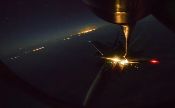 An F-15 Strike Eagle, assigned to the 433rd Weapons Squadron, Nellis Air Force Base, Nev., is refueled in-air during Deliberate Strike Night over the Nevada Test and Training Range, June 16, 2016. With approximately 60 airframes working together serve to accomplish DSN focus of Air Force low-observable and conventional platforms deliberately targeting an adversary’s simulated IADS in an antiaccess, area denial scenario. (U.S. Air Force photo by Airman 1st Class Kevin Tanenbaum)