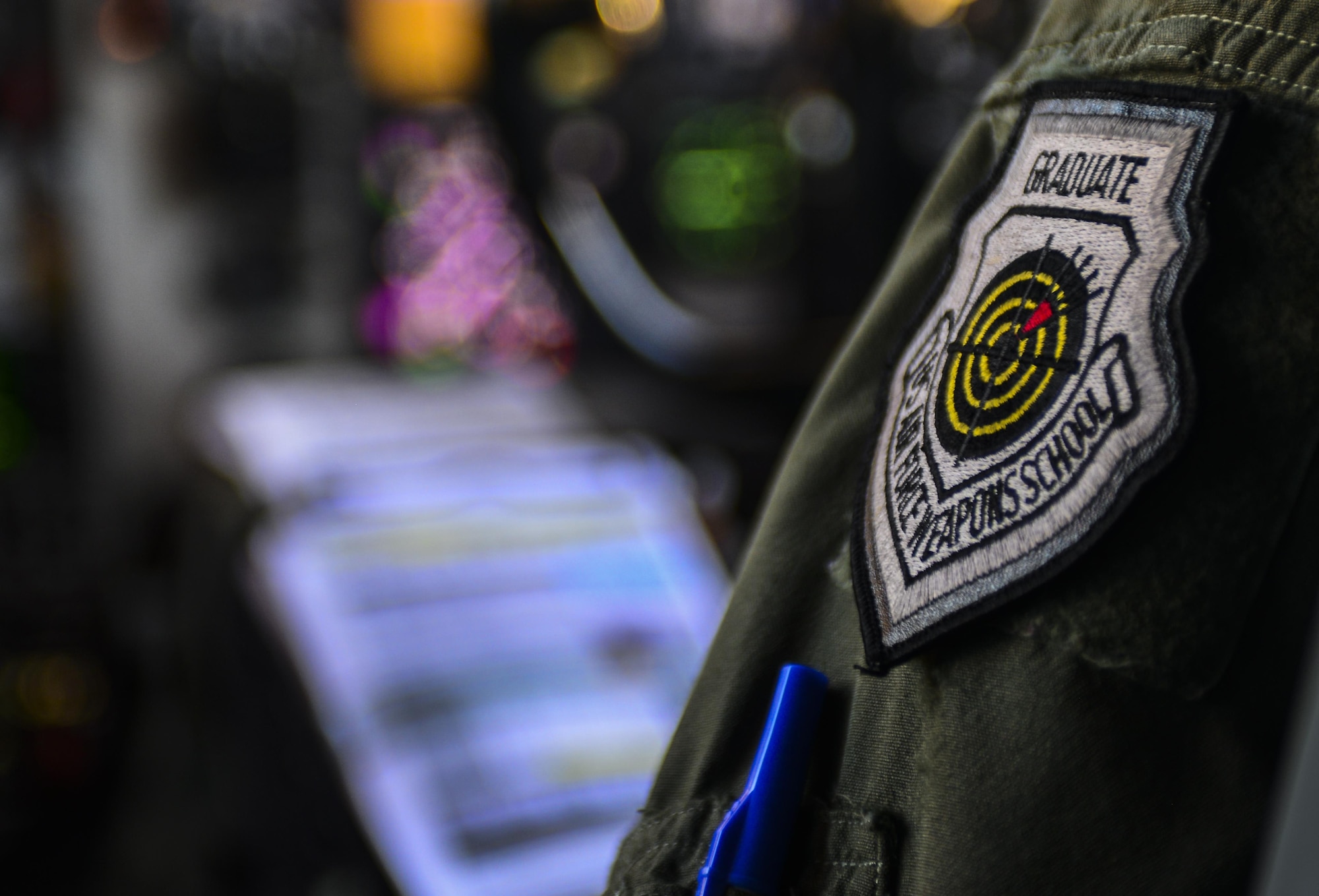 Maj. Justin Hargrove, 509th Weapons Squadron KC-135 pilot, Fairchild Air Force Base, Wash., wears the coveted United States Weapons School Graduate Patch during Deliberate Strike Night at Nellis Air Force Base, Nevada, June 16, 2016. At the conclusion of nearly 400 hours of graduate level academics and combat training missions, the Weapons School course comes climaxes with a week-long exercise known as Advanced Integration. (U.S. Air Force photo by Airman 1st Class Kevin Tanenbaum)  