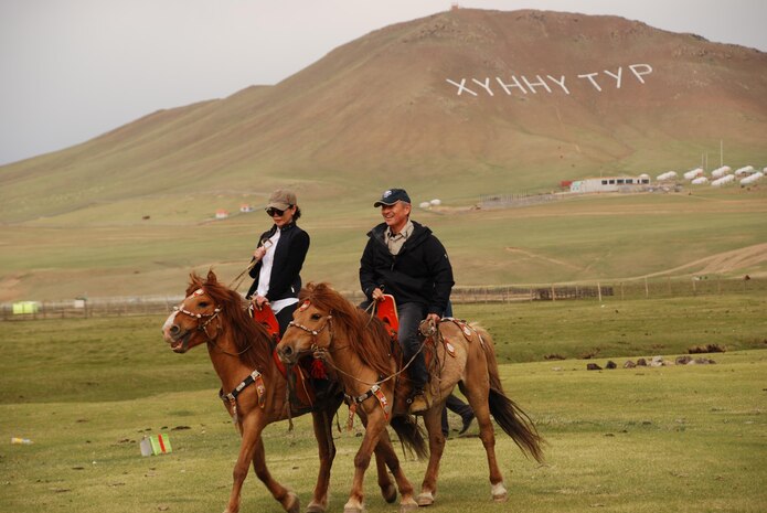 160522-A-ZZ999-085 NALAIKH, Mongolia (May 22, 2016) - Adm. Harry Harris, Commander of U.S. Pacific Command (PACOM), rides his horse, “Volunteer,” with Haliun Erdenebat, PACOM Program manager, Office of Defense Cooperation, at the Khaan Jims camp. Maj. Gen. Dulamsuren Davaa, Chief of the General Staff of Mongolia, presented Volunteer to Harris as part of a special Mongolian tradition. A native of East Tennessee, Harris named the horse “Volunteer” to honor his home state and Mongolia’s leadership in peacekeeping missions in the Indo-Asia-Pacific region. Harris visited Mongolia during the annual multinational peacekeeping exercise Khaan Quest, which served as this year’s capstone exercise for the U.S. State Department’s Global Peace Operations Initiative program. (U.S. Army photo by Maj. Renee Michel/Released)