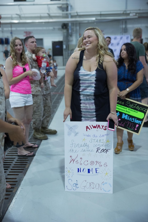 Friends, family members and loved ones wait for the return of Marines and Sailors with Marine Attack Squadron (VMA) 214 “Black Sheep” and Marine Aviation Logistics Squadron 13 “Black Widows” aboard Marine Corps Air Station Yuma, Ariz., June 7. Approximately 100 Marines and Sailors completed a seven-month deployment with the 31st Marine Expeditionary Unit and supported missions in the Pacific theater. (U.S. Marine Corps photo by Sgt. Lillian Stephens/Released)