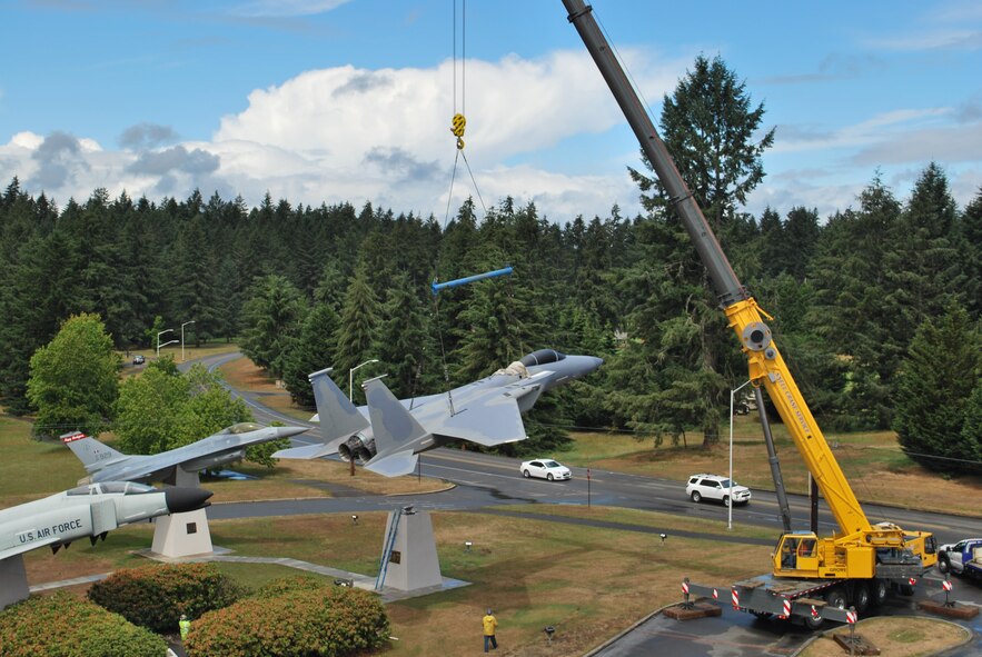 A large crane carefully hoisted a McDonnel Douglas F-15A Eagle onto its display pedestal at the Western Air Defense Sector (WADS) Air Park June 14.  The unit received approval from the National Museum of the Air Force to acquire the F-15 from the Aerospace Maintenance and Regeneration Group (also known as the "Boneyard") located at Davis-Monthan AFB, Ariz.  The WADS mission is to scramble Air National Guard F-15 and F-16 alert fighters at a moment's notice in order to identify, detect and defend against airborne threats.  There will be a formal dedication ceremony Sept. 13 at the WADS parade grounds.  (U.S. Air National Guard photo by Capt. Kimberly Burke)