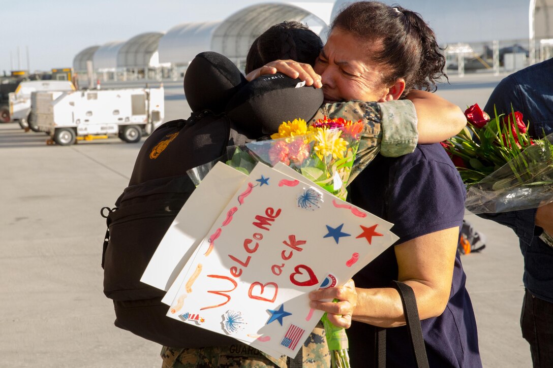 A Marine with Marine Attack Squadron (VMA) 214 “Black Sheep” embraces her mother aboard Marine Corps Air Station Yuma, Ariz., June 7. Approximately 100 Marines and Sailors returned from a seven-month deployment with the 31st Marine Expeditionary Unit and supported missions in the Pacific theater. (U.S. Marine Corps photo by Sgt. Lillian Stephens/Released)