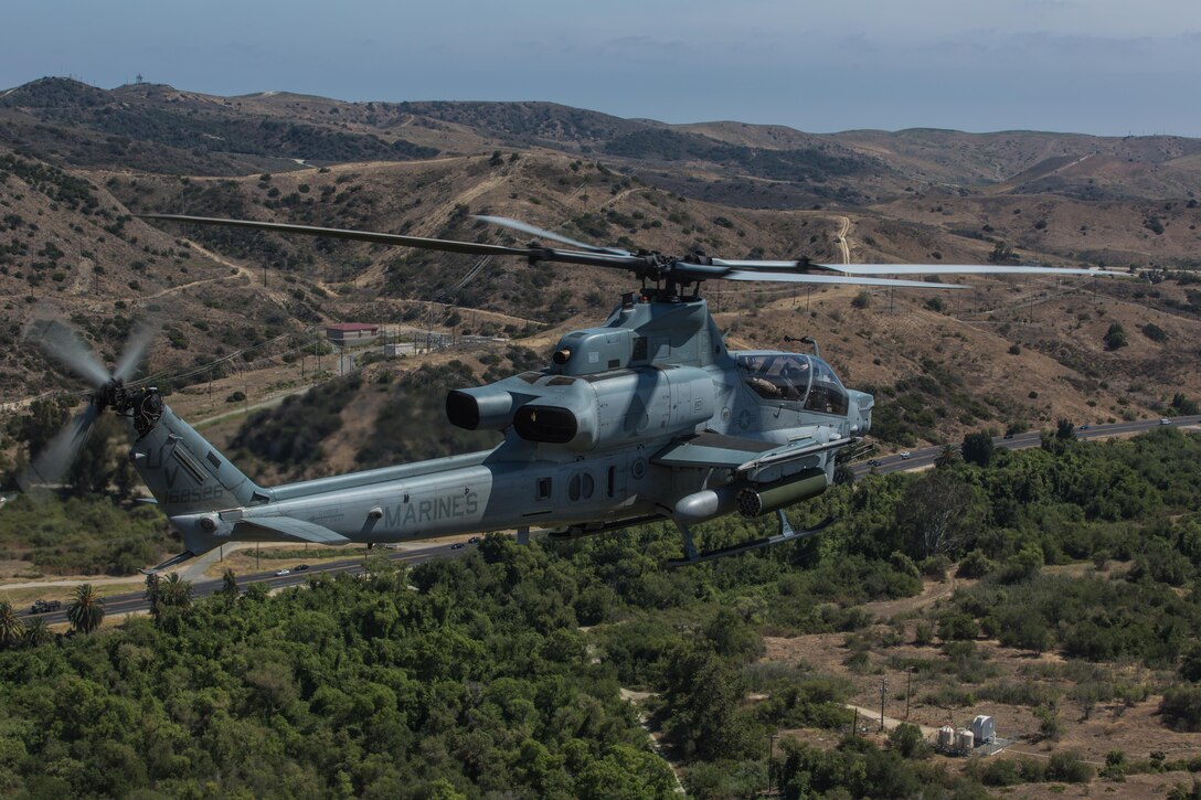 Marine Light Attack Helicopter Squadron (HMLA) 267 “Stingers” prepares to land aboard Marine Corps Air Station Camp Pendleton, Calif., June 10. Marines with HMLA-267 supported Marines with 3rd Battalion, 7th Marine Regiment during a close-air-support training mission aboard the combat center. (U.S. Marine Corps photo by Sgt. Lillian Stephens/Released) (U.S. Marine Corps photo by Sgt. Lillian Stephens/Released)