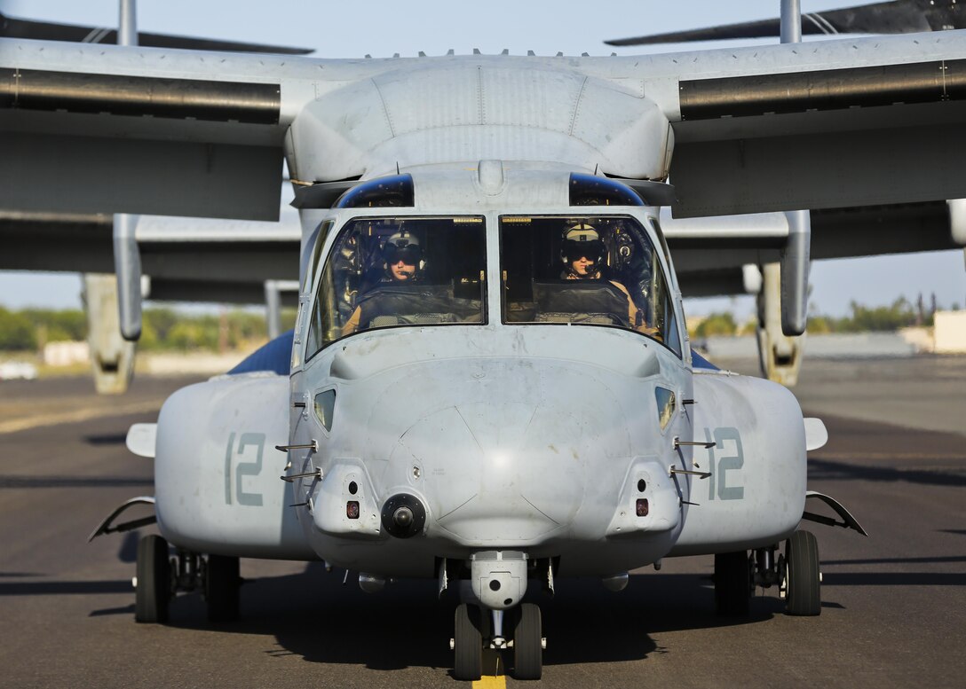 Two U.S. Marine Corps MV-22 Osprey pilots with Marine Medium Tiltrotor Squadron 161 prepare to depart from Hickam Air Force Base, Hawaii, May 19, 2015. Senior military leaders of allied and partner nations visited Hawaii to participate in the U.S. Pacific Command Amphibious Leaders Symposium. 