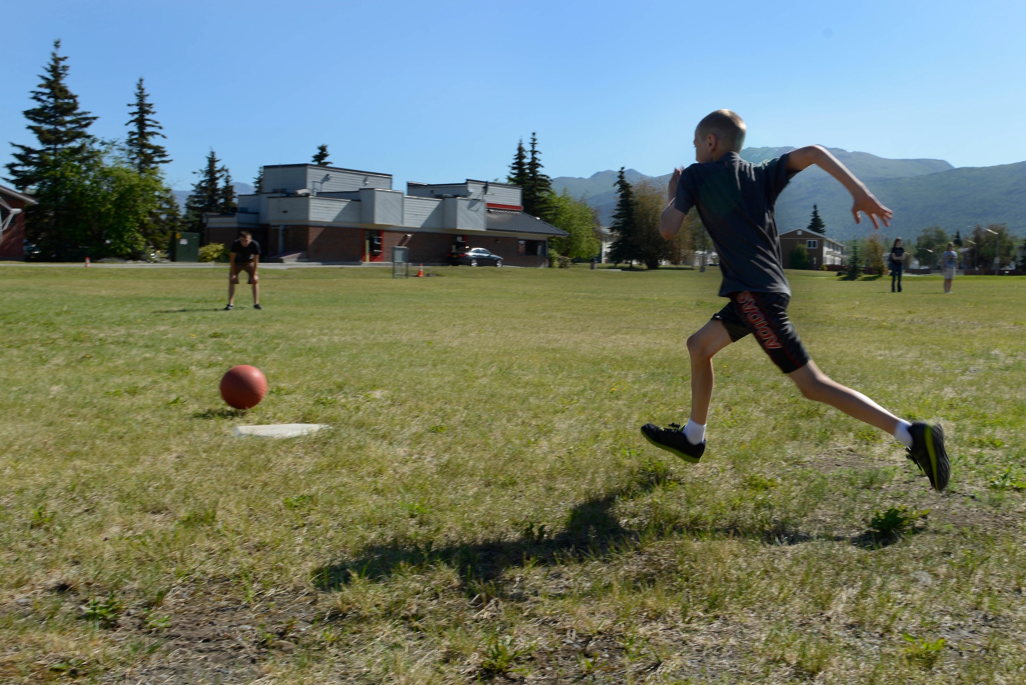 Children play kickball during the Read for the Win summer reading program at the Joint Base Elmendorf-Richardson Library, Alaska, June 16, 2016. During the program, participants submit their minutes read and qualify to win prizes. (U.S. Air Force photo by Airman 1st Class Valerie Monroy)