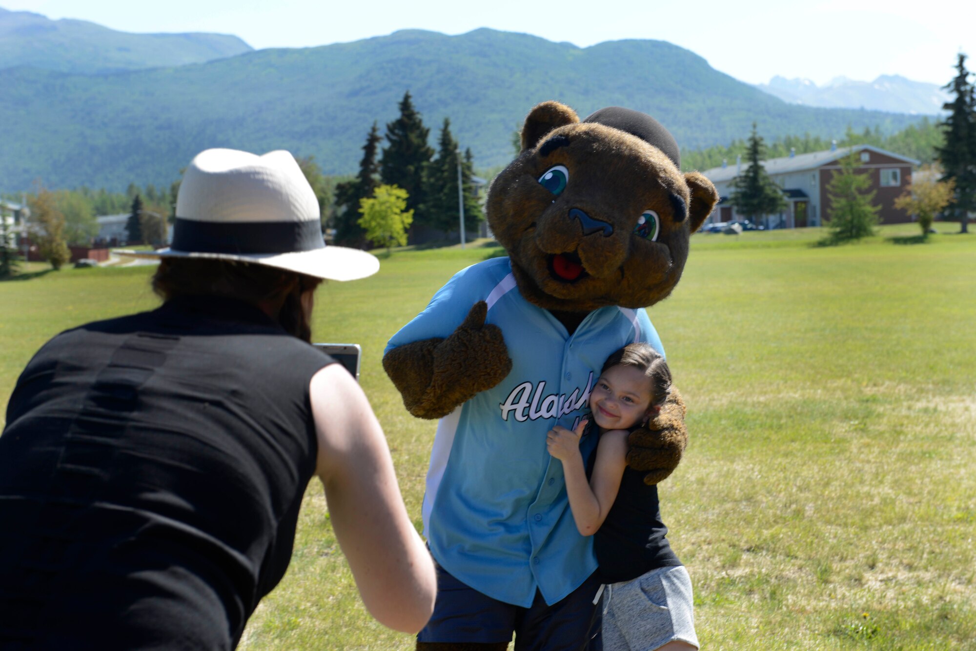 Participants in the Read for the Win summer reading program, meet “Kodi” from the Alaska Aces, at the Joint Base Elmendorf-Richardson Library, Alaska, June 16, 2016. The library will host various outdoor activities in support of the program. (U.S. Air Force photo by Airman 1st Class Valerie Monroy)