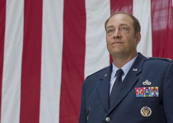 Col. Sean Robertson, 374th Maintenance Group incoming commander, looks onto the Airmen of the 374th Maintenance Squadron and 374th Aircraft Maintenance Squadron during a change of command ceremony at Yokota Air Base, Japan, June 20, 2016. Robertson served as the deputy commander of the 374 MXG for three years prior to his current position. (U.S. Air Force photo by Yasuo Osakabe/Released)