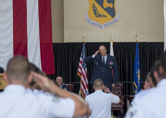 Col. Sean Robertson, 374th Maintenance Group commander, renders his first salute as commander during a change of command ceremony at Yokota Air Base, Japan, June 20, 2016. Robertson served as the deputy commander of the 374 MXG for three years prior to his current position. (U.S. Air Force photo by Yasuo Osakabe/Released)
